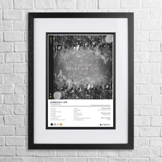 A4 custom design poster of Coldplay - Everyday Life in a black, dual-aspect frame on a white brick background