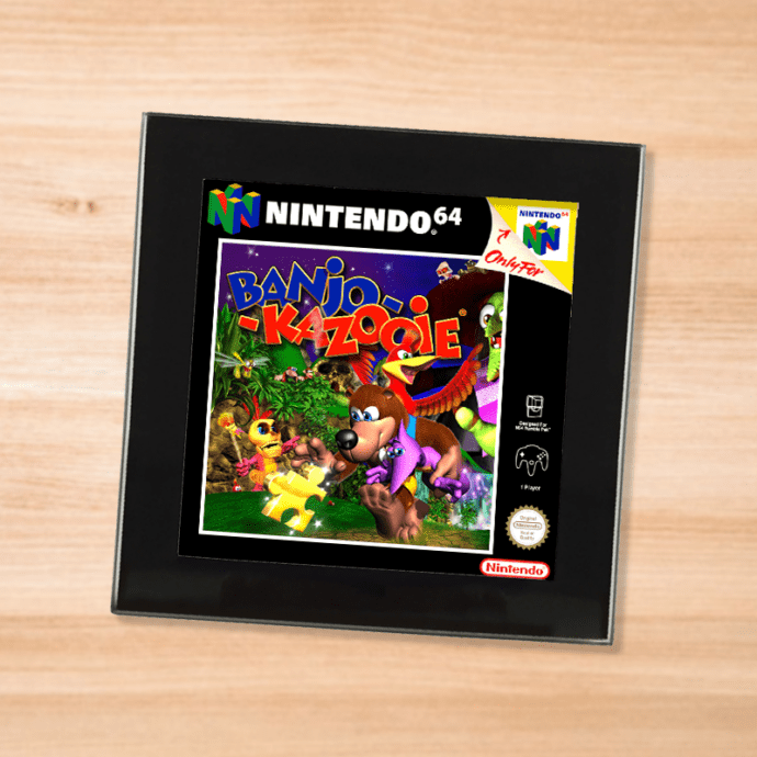 Black glass Banjo Kazooie coaster on a wood table