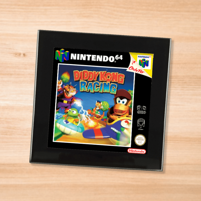 Black glass Diddy Kong Racing coaster on a wood table