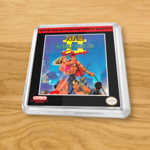 Plastic Double Dragon II coaster on a wood table