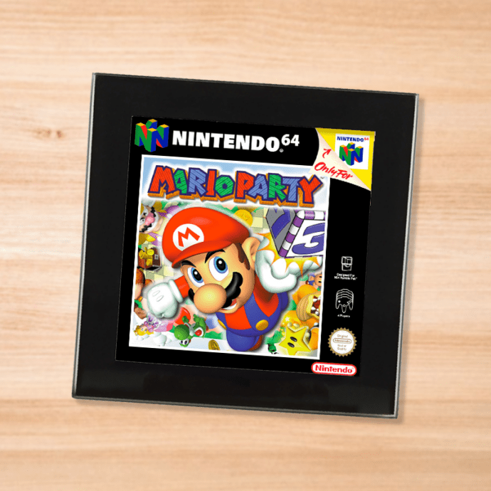 Black glass Mario Party coaster on a wood table