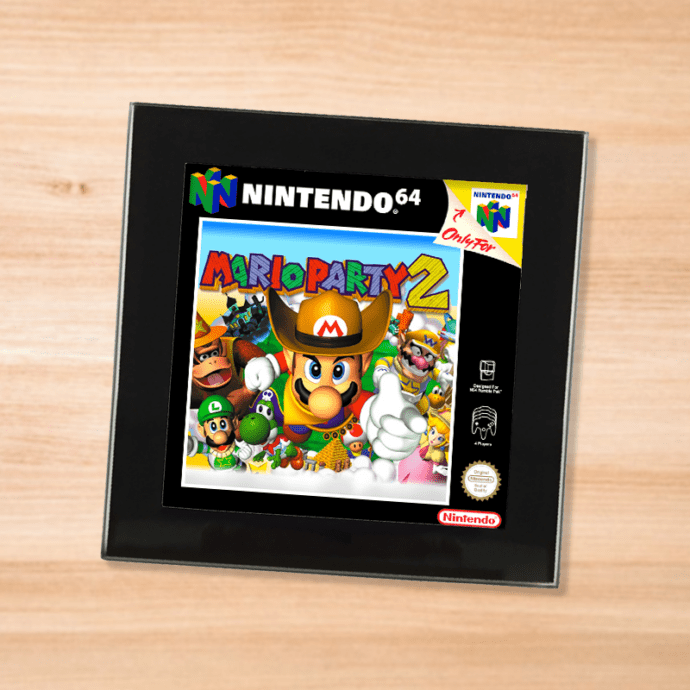 Black glass Mario Party 2 coaster on a wood table