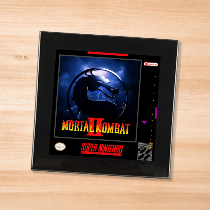 Black glass Mortal Kombat 2 coaster on a wood table