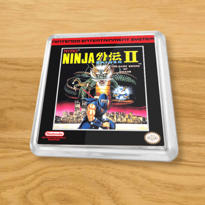 Plastic Ninja Gaiden II coaster on a wood table