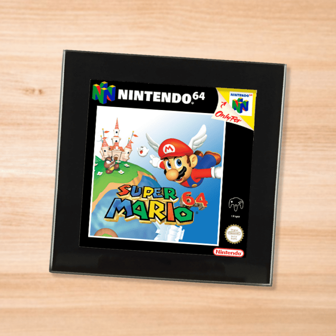 Black glass Super Mario 64 coaster on a wood table