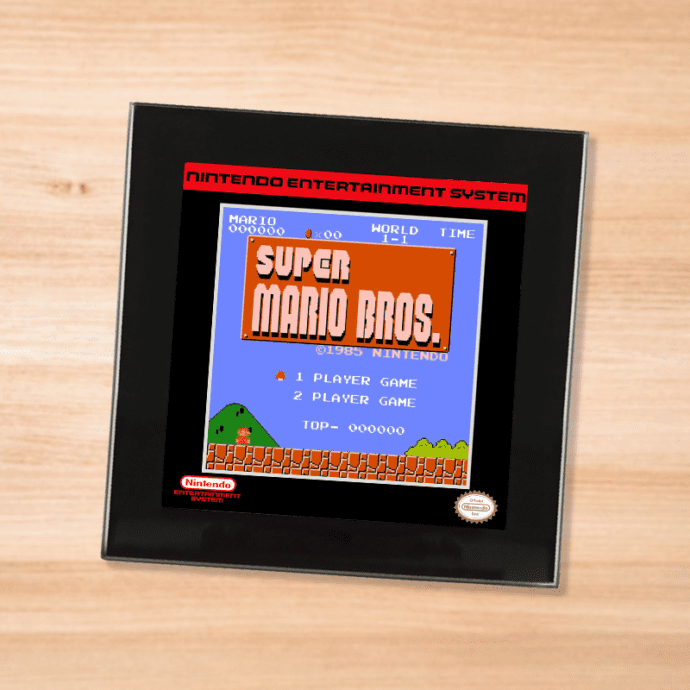 Black glass Super Mario Bros coaster on a wood table