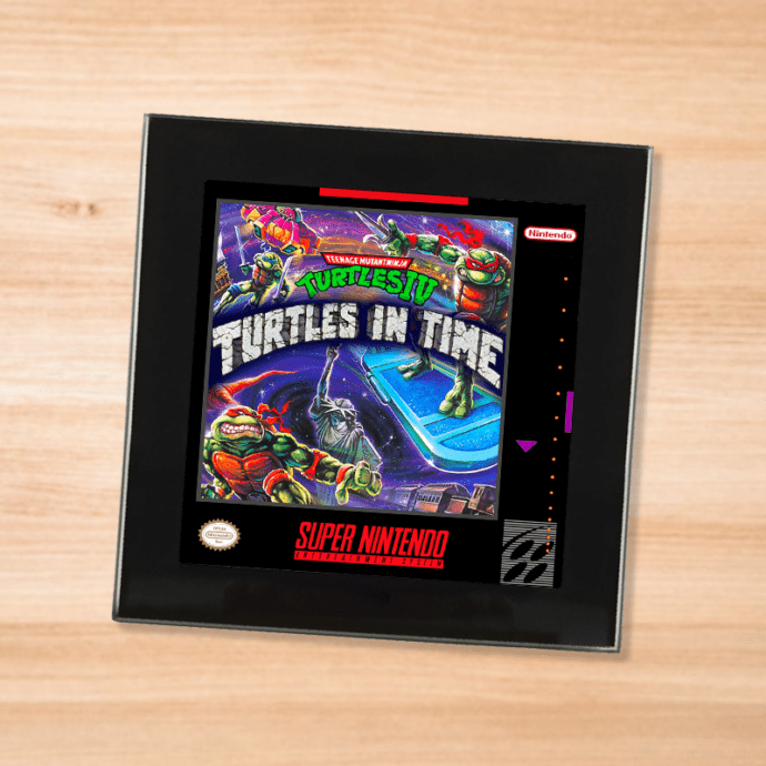 Black glass TMNT 4 Turtles In Time coaster on a wood table