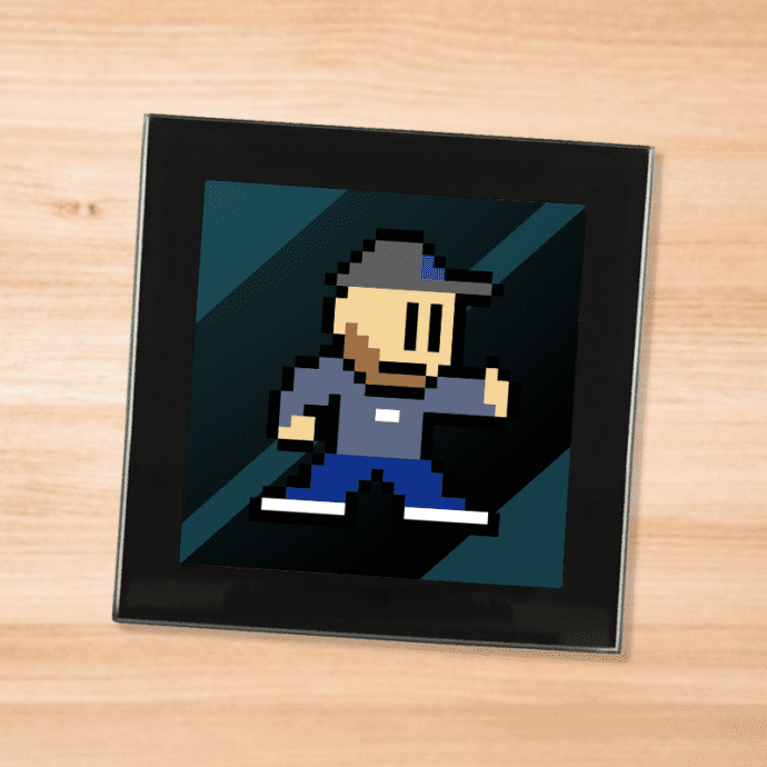 Black glass EternalLeeHD - 8-bit logo coaster on a wood table