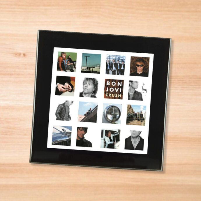 Black glass Bon Jovi - Crush coaster on a wood table