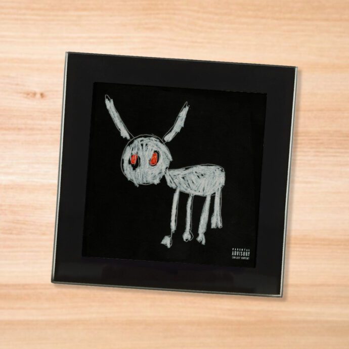 Black glass Drake - For All the Dogs coaster on a wood table