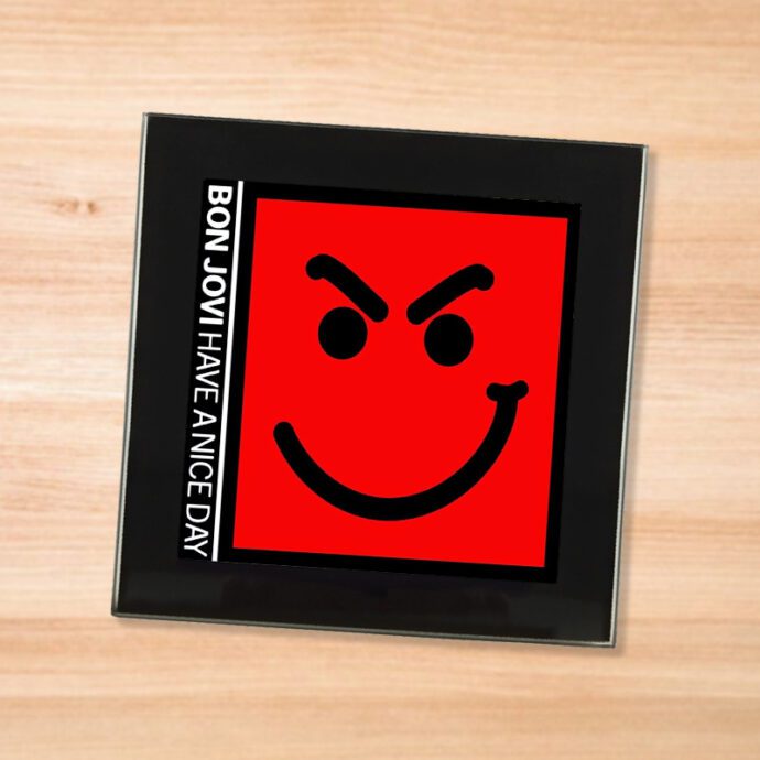 Black glass Bon Jovi - Have A Nice Day coaster on a wood table