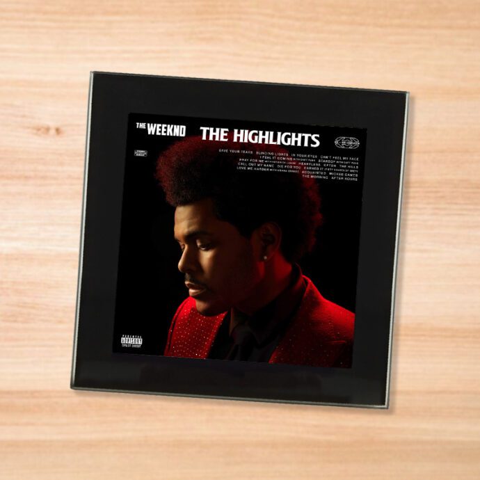Black glass The Weeknd - Highlights coaster on a wood table