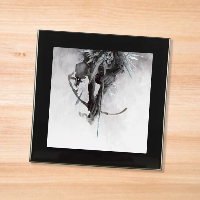 Black glass Linkin Park - Hunting Party coaster on a wood table