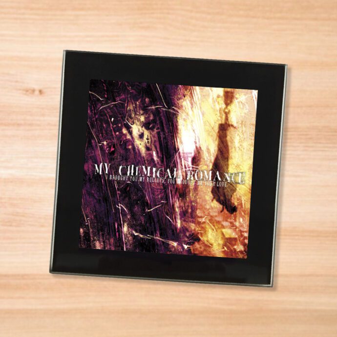 Black glass My Chemical Romance - I Brought You My Bullets coaster on a wood table