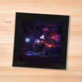 Black glass Midnight - Monsters coaster on a wood table