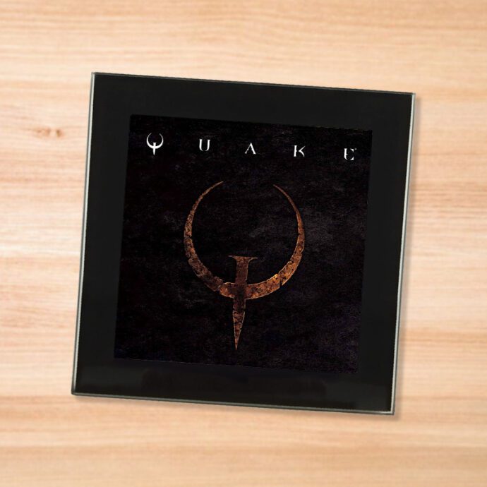 Black glass Quake coaster on a wood table