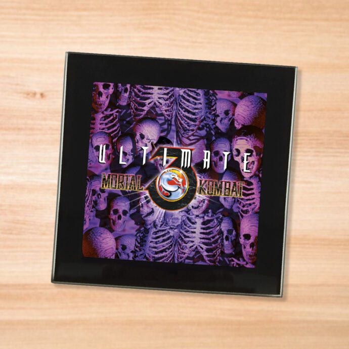 Black glass Mortal Kombat 3 coaster on a wood table
