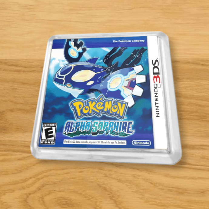 Pokemon Alpha Sapphire plastic coaster on a wood table