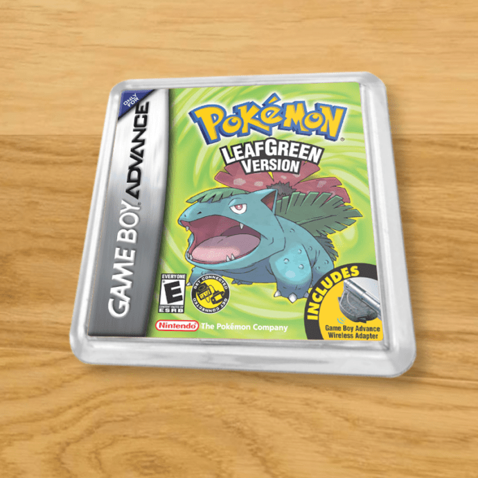 Pokemon Leaf Green plastic coaster on a wood table