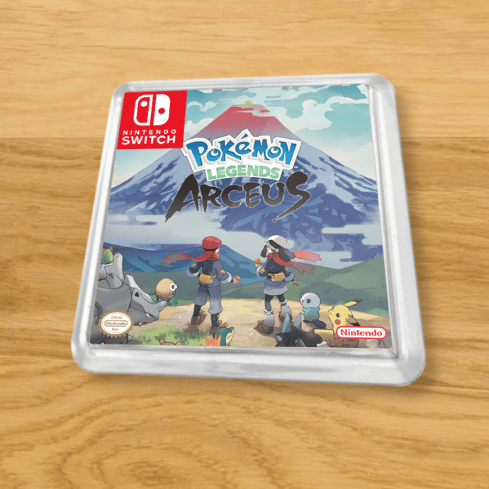 Pokemon Legends Arceus plastic coaster on a wood table