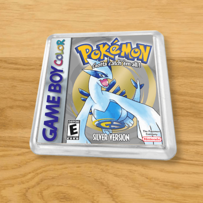Pokemon Crystal plastic coaster on a wood table
