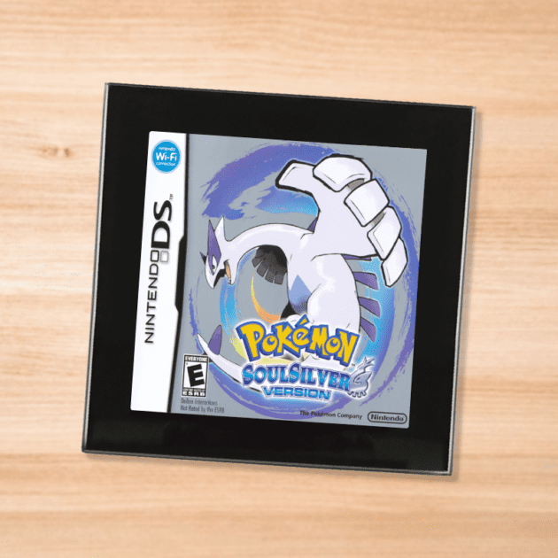 Pokemon Soul Silver black glass coaster on a wood table