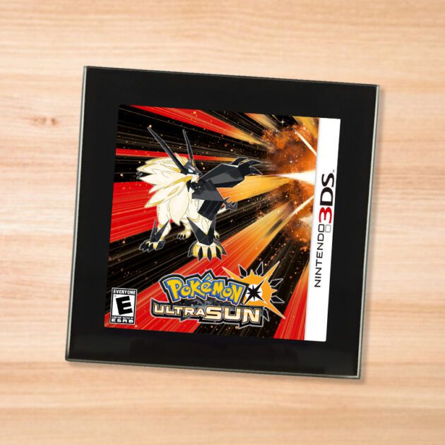 Pokemon Ultra Sun black glass coaster on a wood table