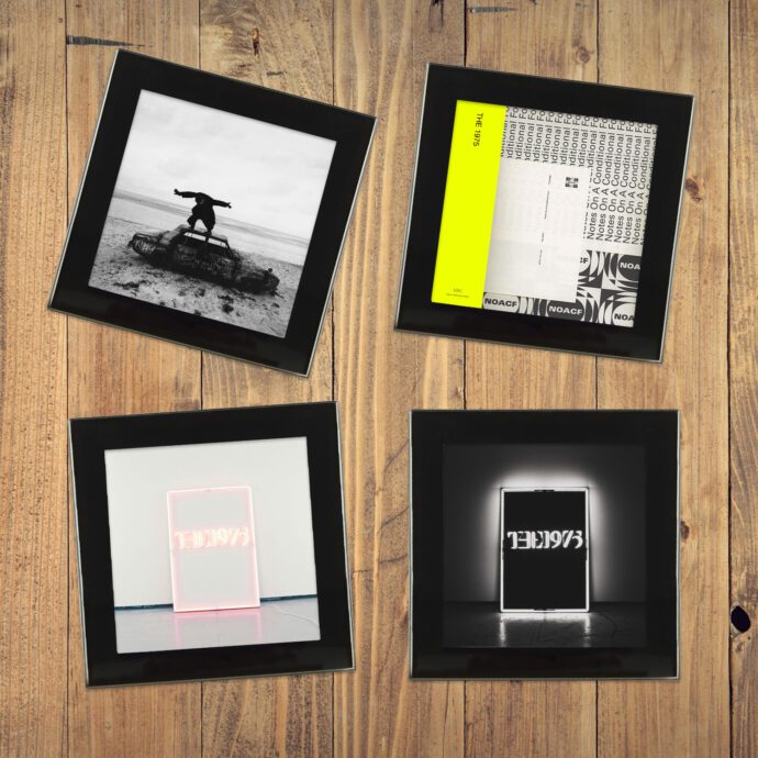 The 1975 Album Art Coasters - 4 glass coasters on a wood table