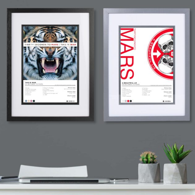 30 Seconds to Mars album poster - 2 framed posters on a dark grey wall