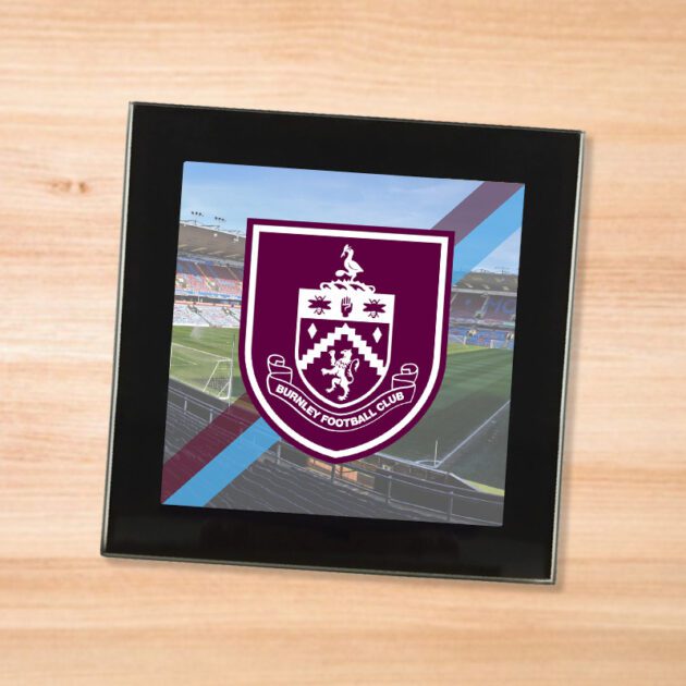 Burnley drinks coaster on a wooden table