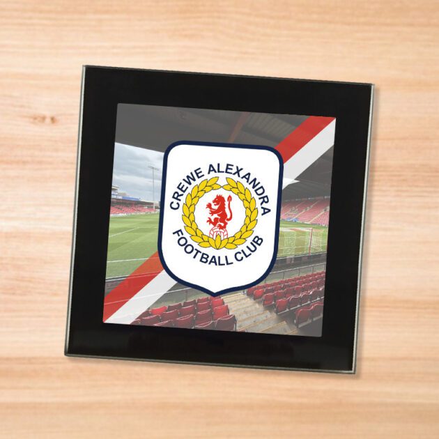 Crewe Aleandra drinks coaster on a wooden table