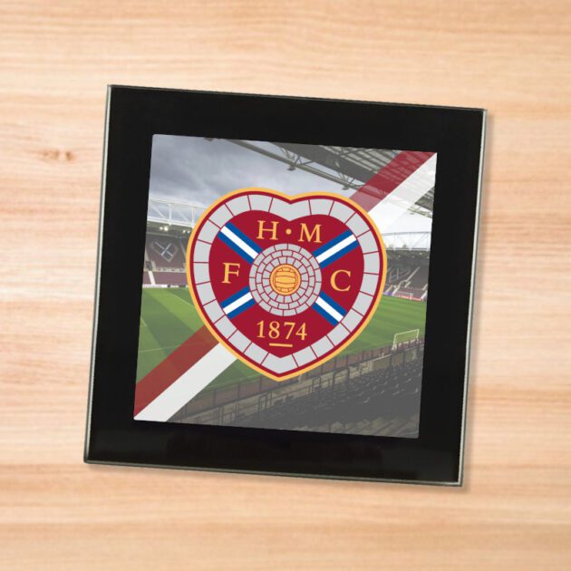 Hearts drinks coaster on a wooden table