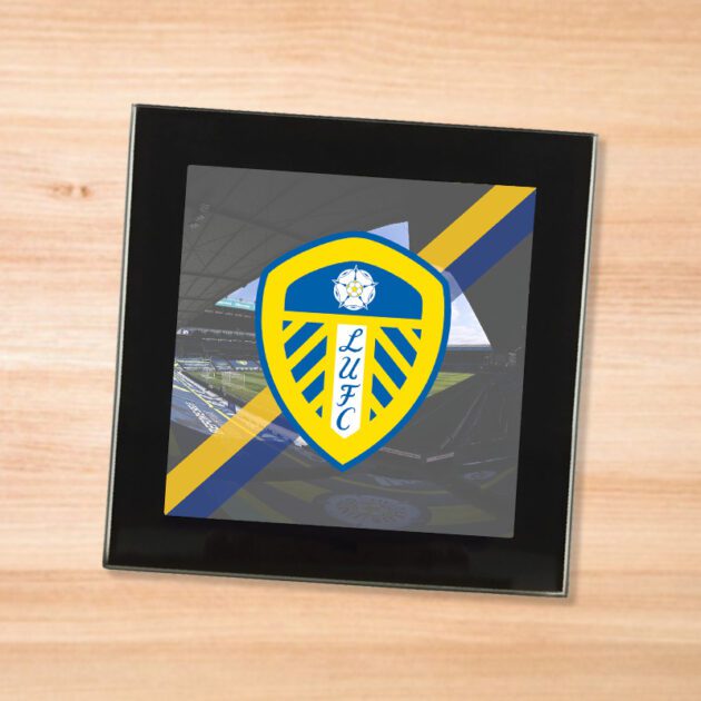 Leeds United drinks coaster on a wooden table