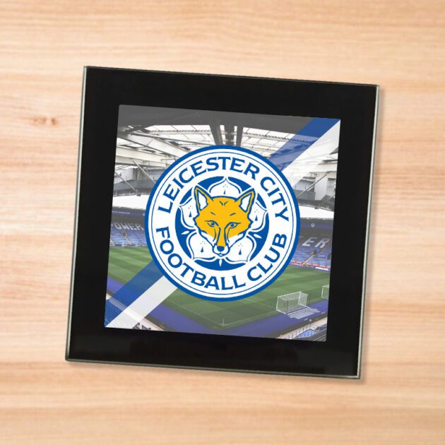 Leicester City drinks coaster on a wooden table