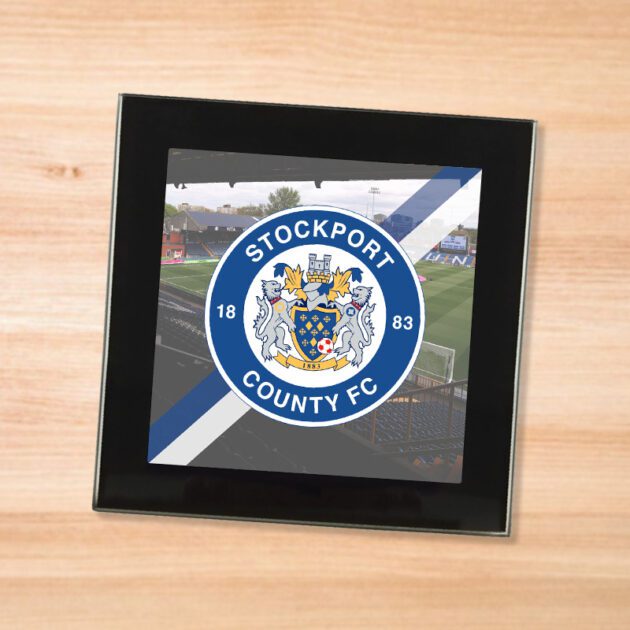 Stockport County drinks coaster on a wooden table